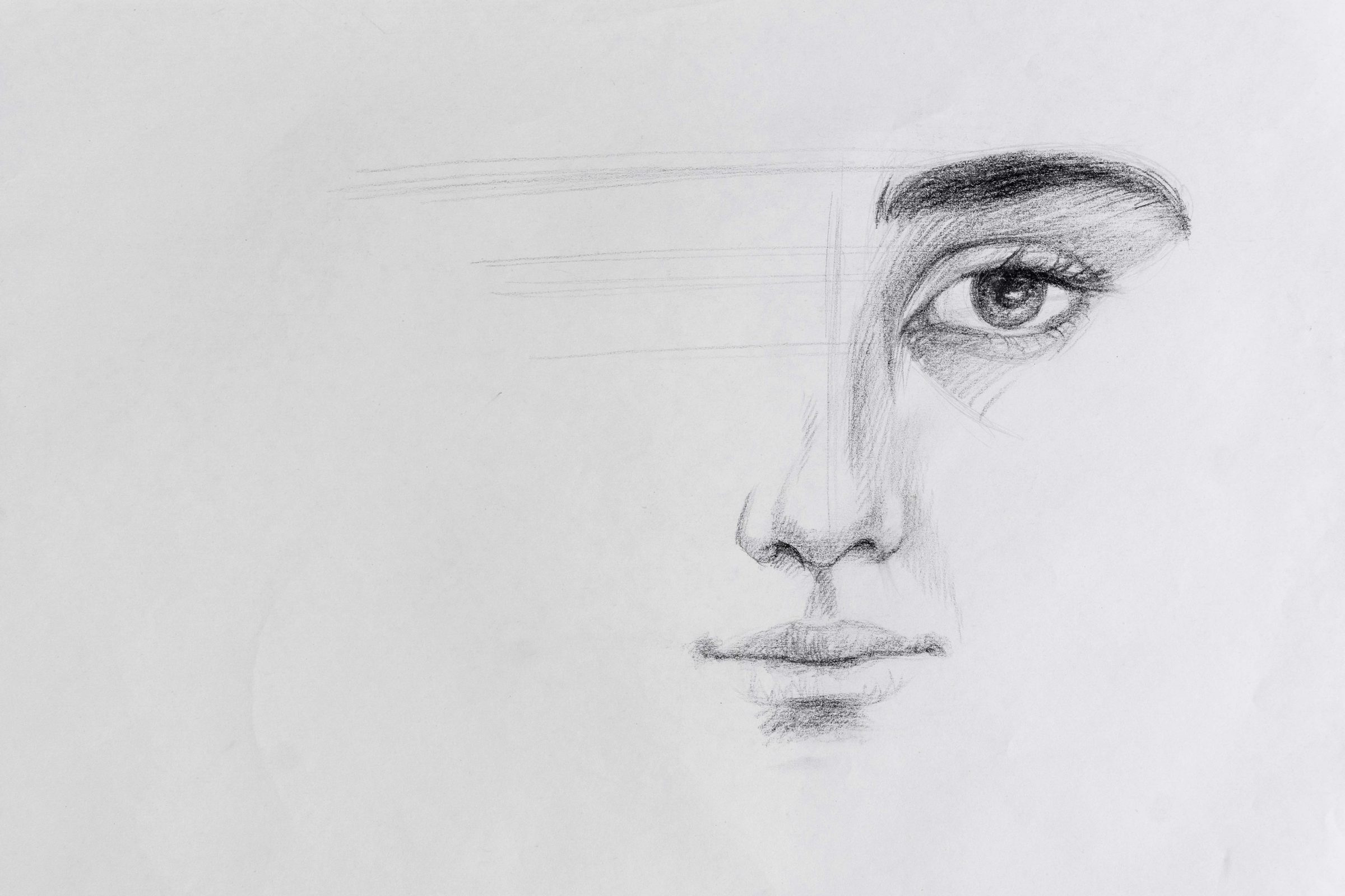 Pencil sketch of a woman’s face with one detailed eye, representing an imagined soulmate portrait.